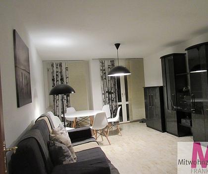 Hübsche Wohnung mit Gartenanteil an absolluter Messenähe